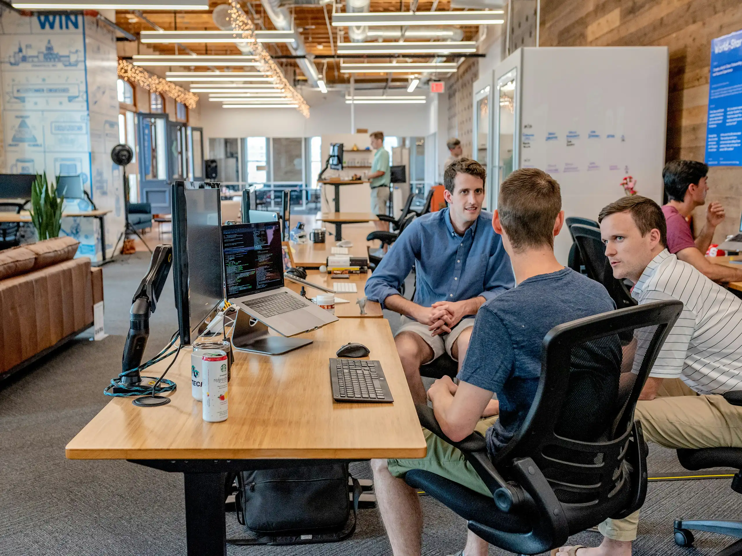 three IT professionals in conversation